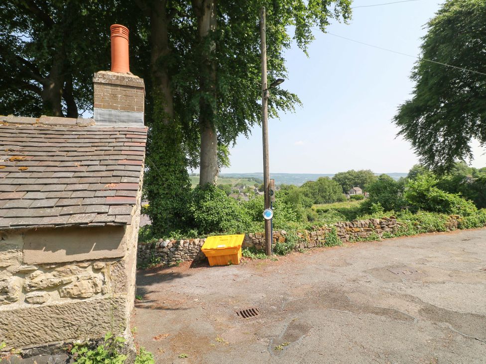 An outdoor view including a chimney and a yellow container at Chimney Cottage in Winster