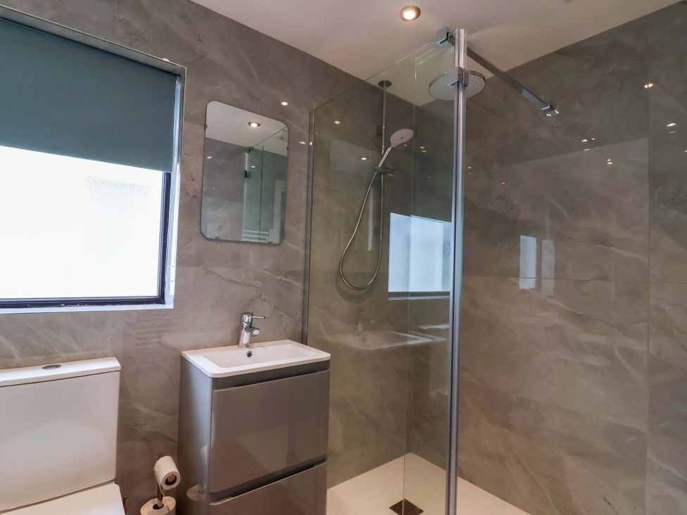 A bathroom with a shower and sink at Kernyk in Camelford