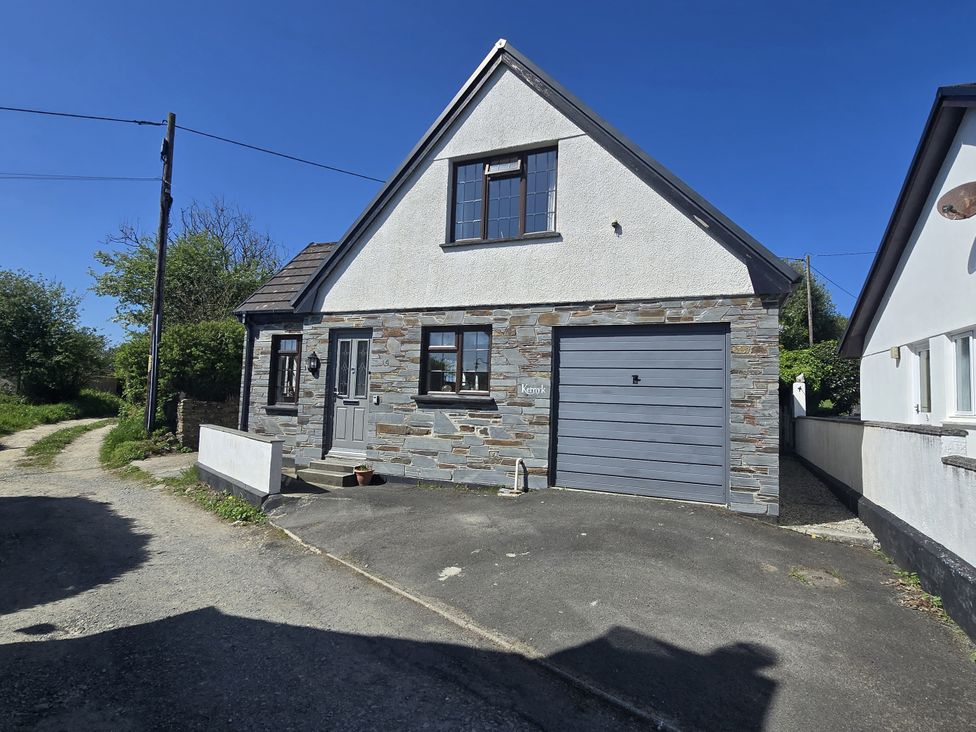 A house with a garage and driveway at Kernyk in Camelford
