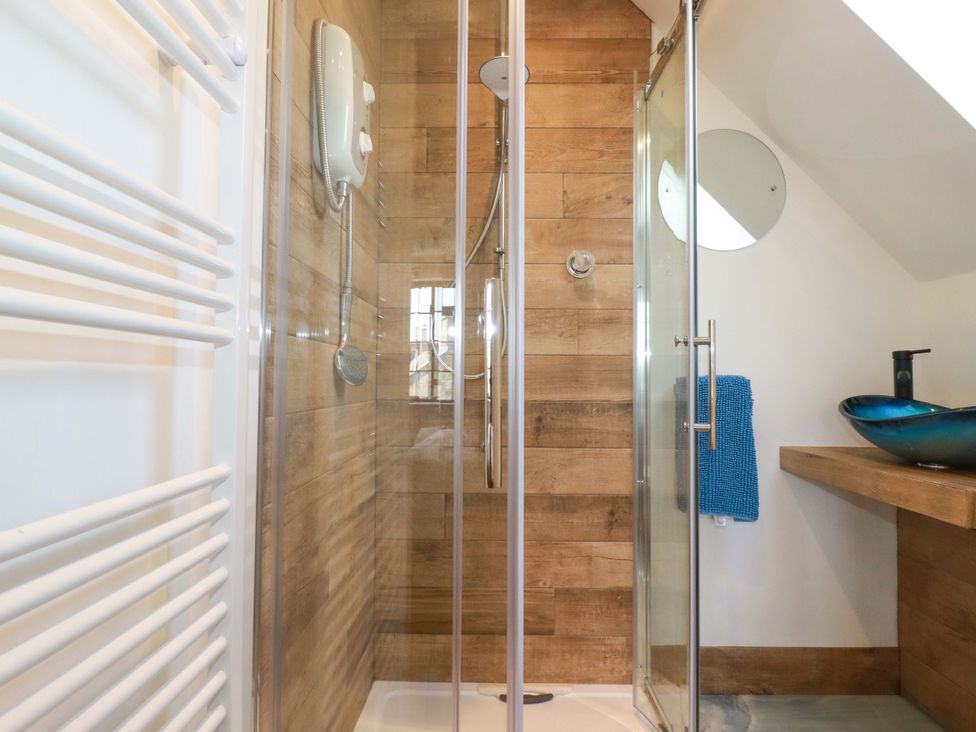 A bathroom with a shower and sink at Kernyk in Camelford