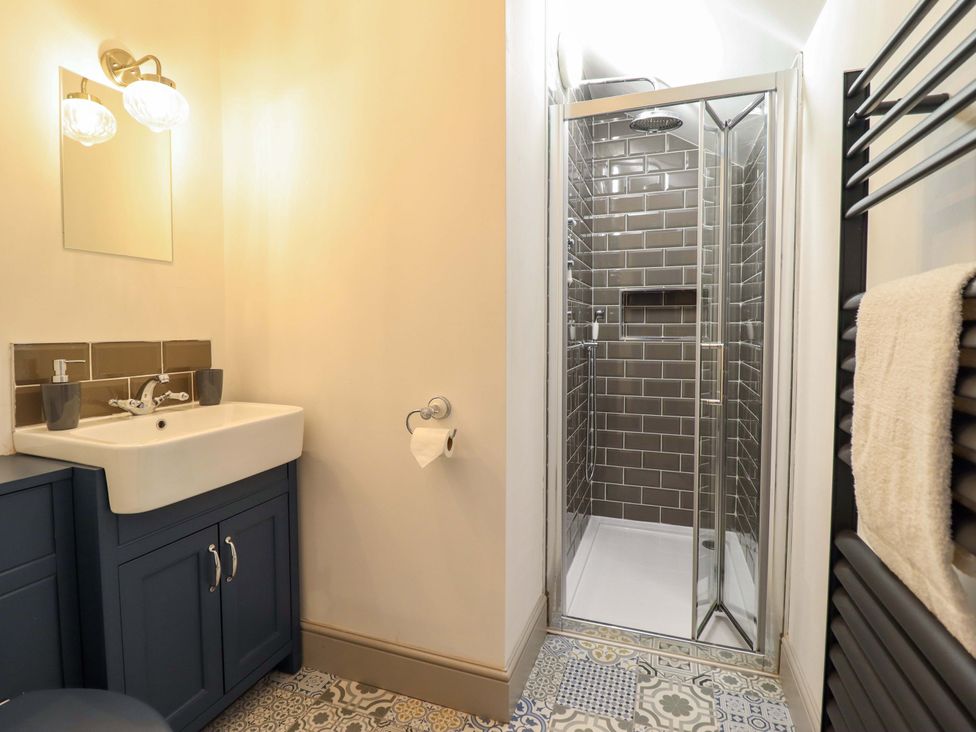 A bathroom with a sink and a shower at The Farmhouse in Oswestry