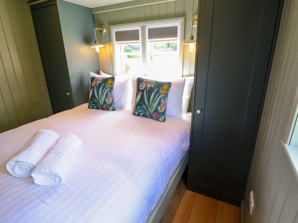 A bedroom with a bed and pillows at Bluebell in Grimsby
