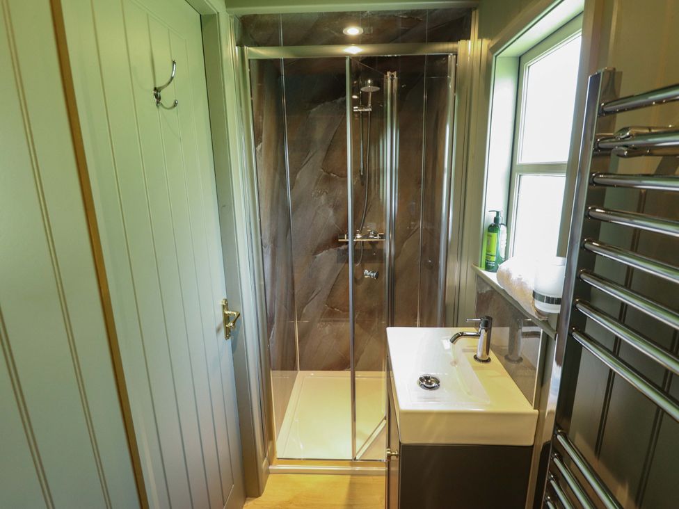 A bathroom with a shower and sink at Bluebell in Grimsby