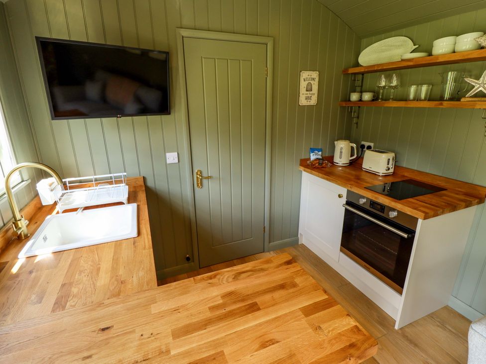 A kitchen with a sink and appliances at Primrose in Grimsby
