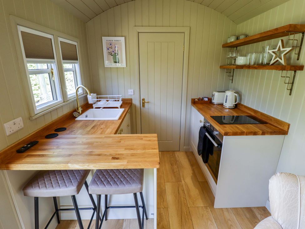 A kitchen with a sink and counter at Snowdrop in Grimsby