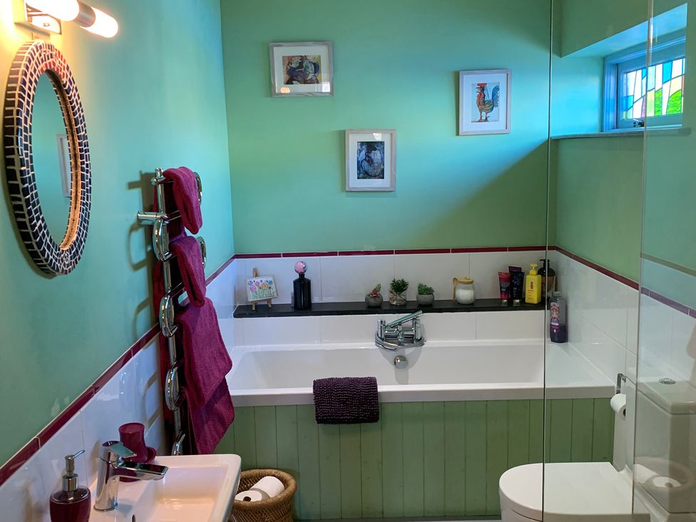 A bathroom with a bathtub and sink at Stargazy Skies near Beacon Drive, St Agnes
