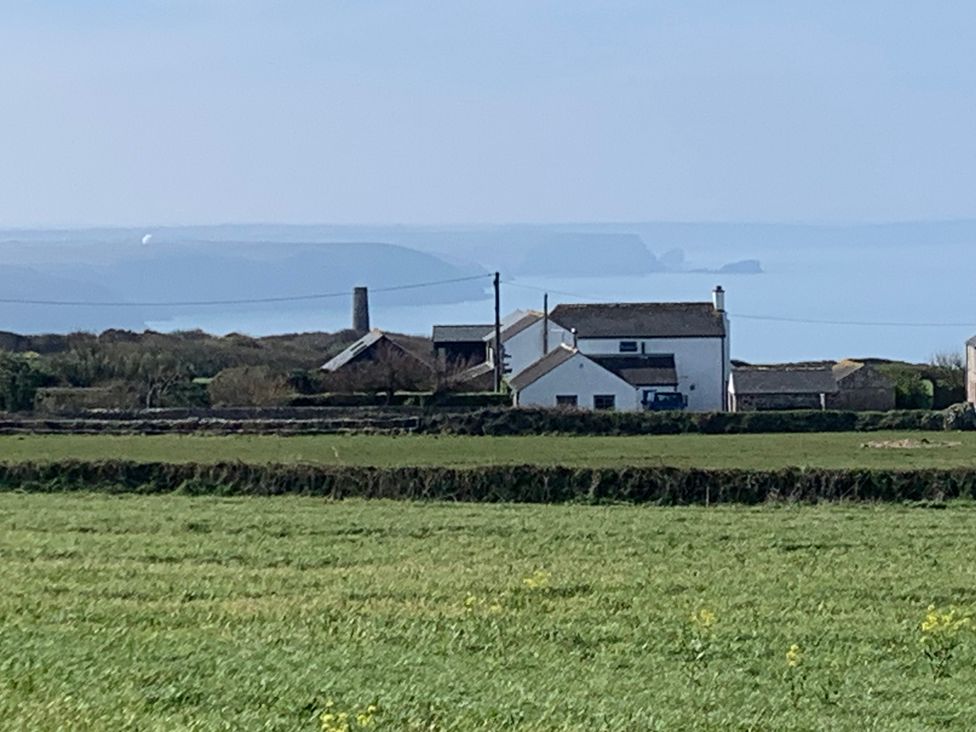 A view of houses and coastline from a field at Stargazy Skies near Beacon Drive near St Agnes