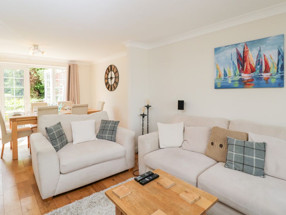 A living room with sofas and a dining area at Lorien in Fifield