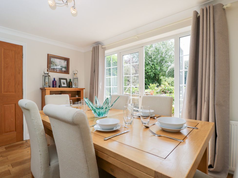 A dining room with a table set for a meal at Lorien in Fifield