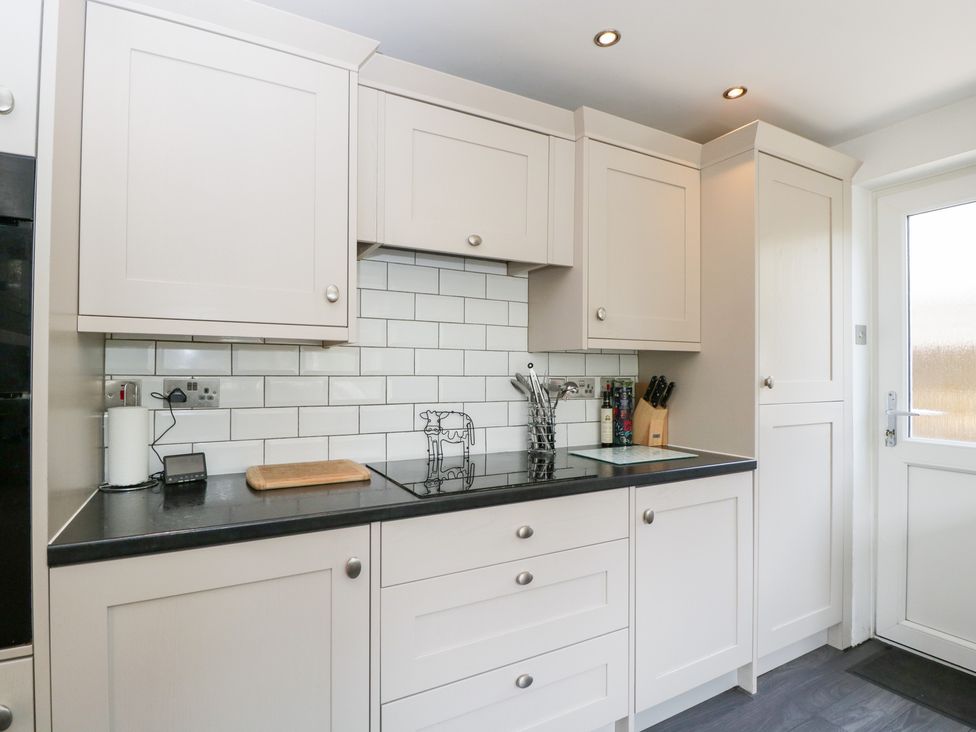 A kitchen with cabinets, sink, and countertop at Lorien in Fifield