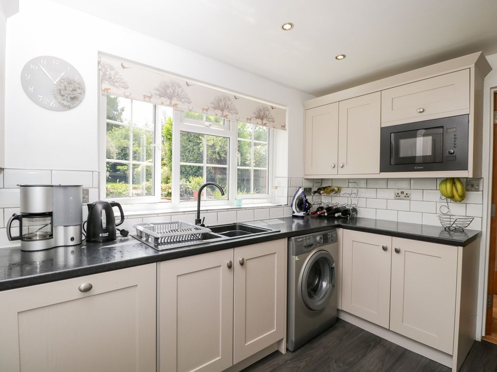 A kitchen with a sink and microwave at Lorien in Fifield