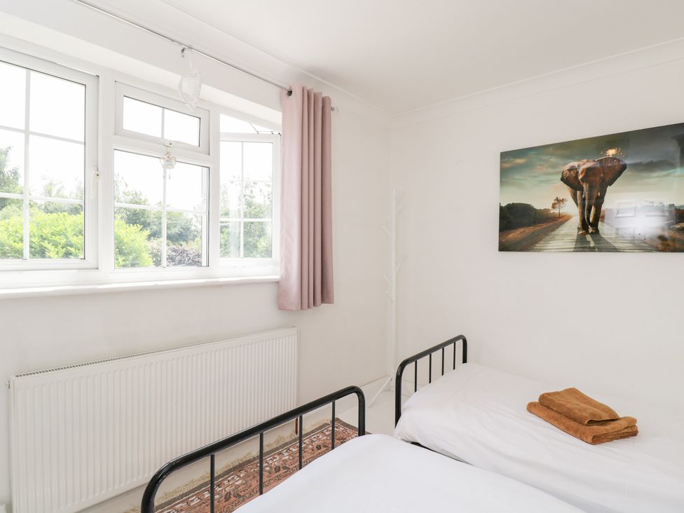 A bedroom with two beds and a window at Lorien in Fifield