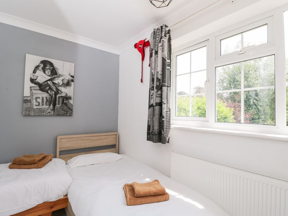 A bedroom with beds and wall art at Lorien in Fifield