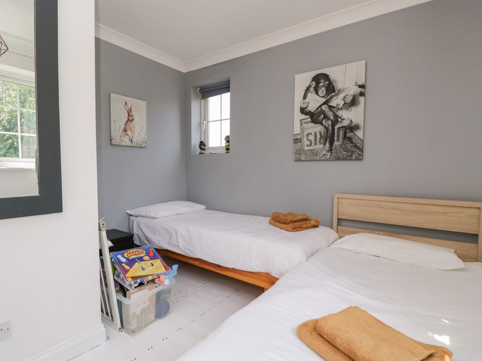 A bedroom with two beds and toys at Lorien in Fifield