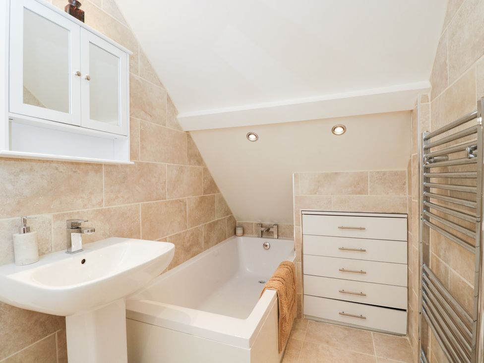 A bathroom with a bathtub and sink at Lorien in Fifield