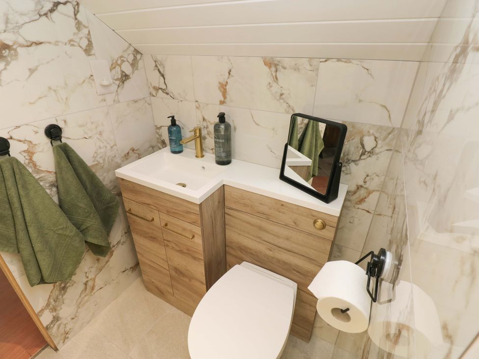 A bathroom with a sink and toilet at Graig Goch in Burry Port