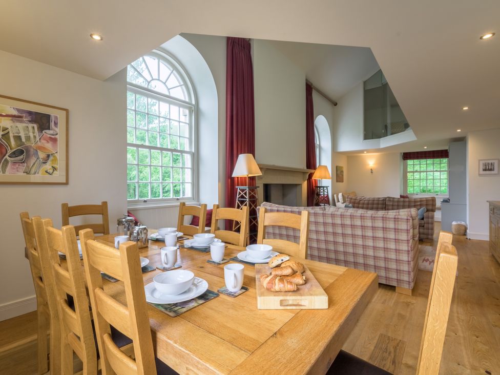 A dining room with a table set for breakfast at The School in Mungrisdale near Caldbeck