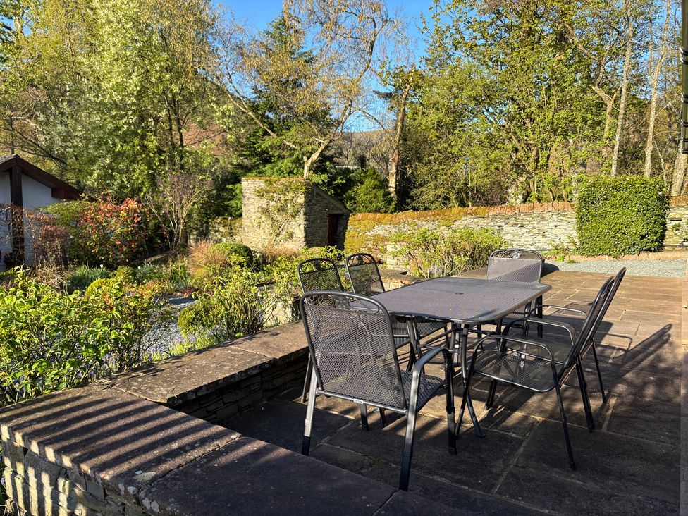 A garden with a table and chairs at The School at Mungrisdale near Keswick