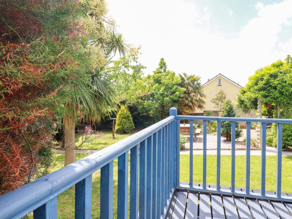 A view from a balcony overlooking a garden at Brockstone Cottage St Austell