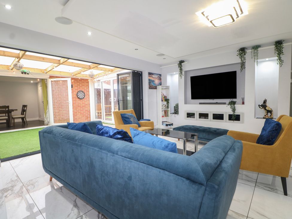 A living room with sofas and a television at Falcon Bal House 