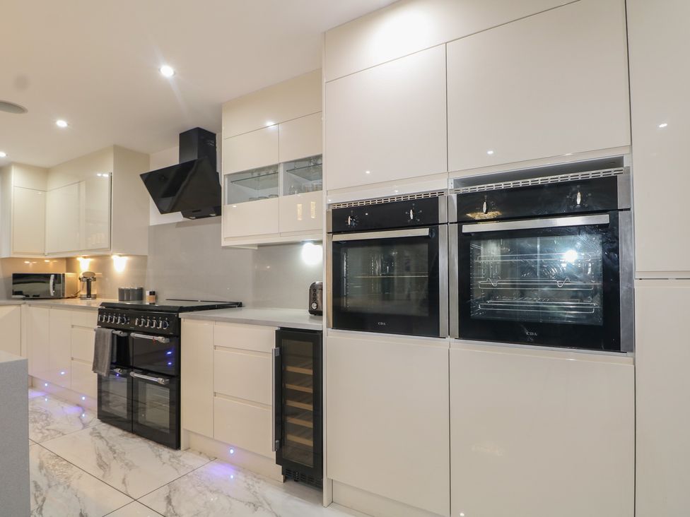 A kitchen with built-in appliances at Falcon Bal House