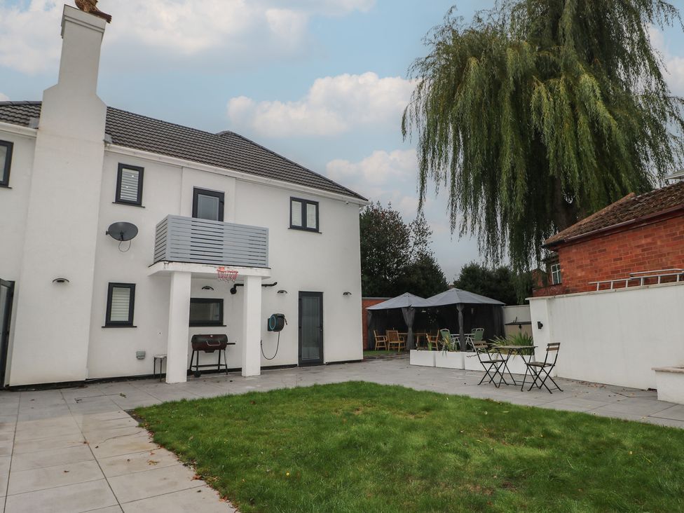 A house with a balcony and patio furniture at Falcon Bal House in 