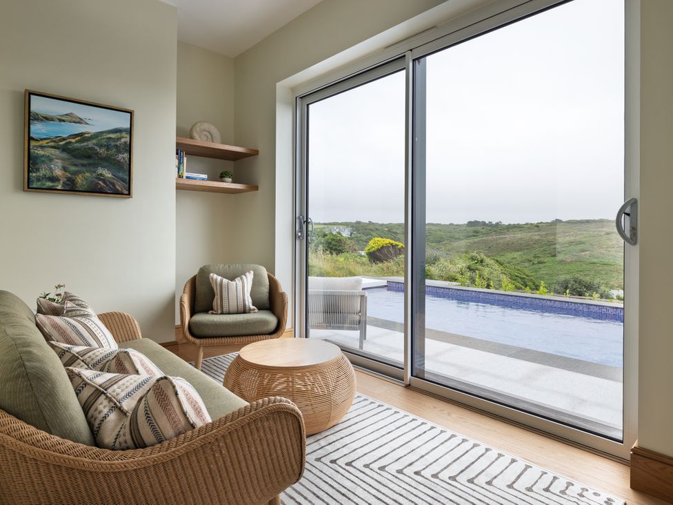 A living room with a sofa and coffee table at Trevean in Mullion