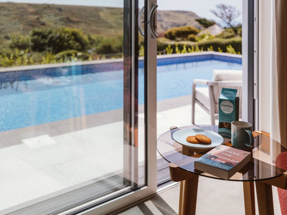 A table with a cookie and a book at Trevean in Mullion