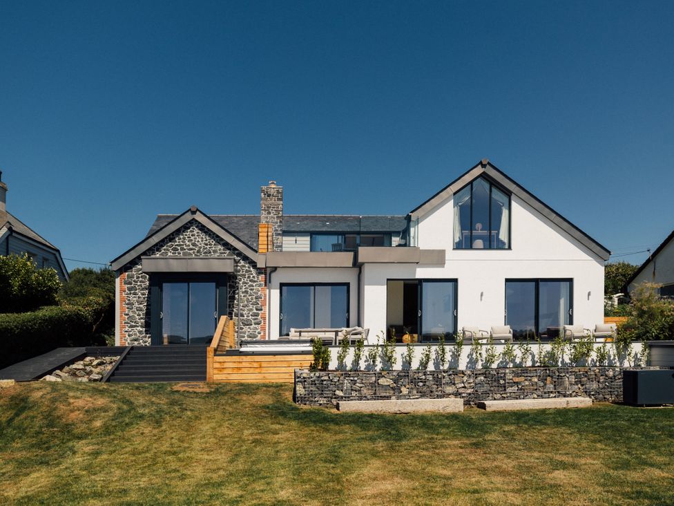 A house with stone features and large windows at Trevean in Mullion