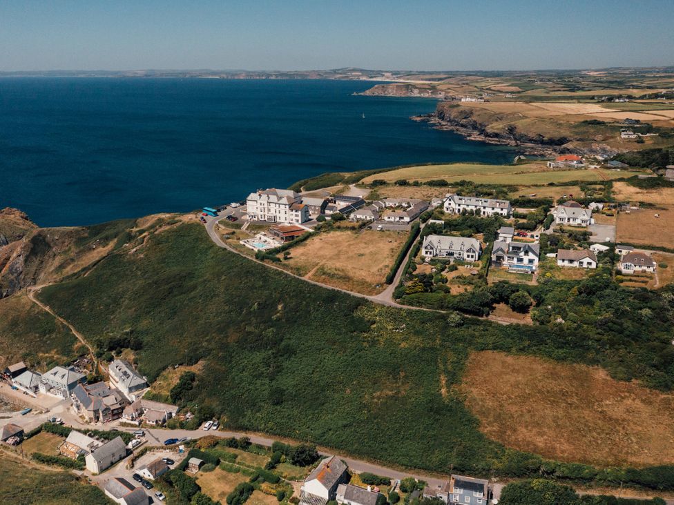 A coastal view with houses and fields at Trevean in Mullion