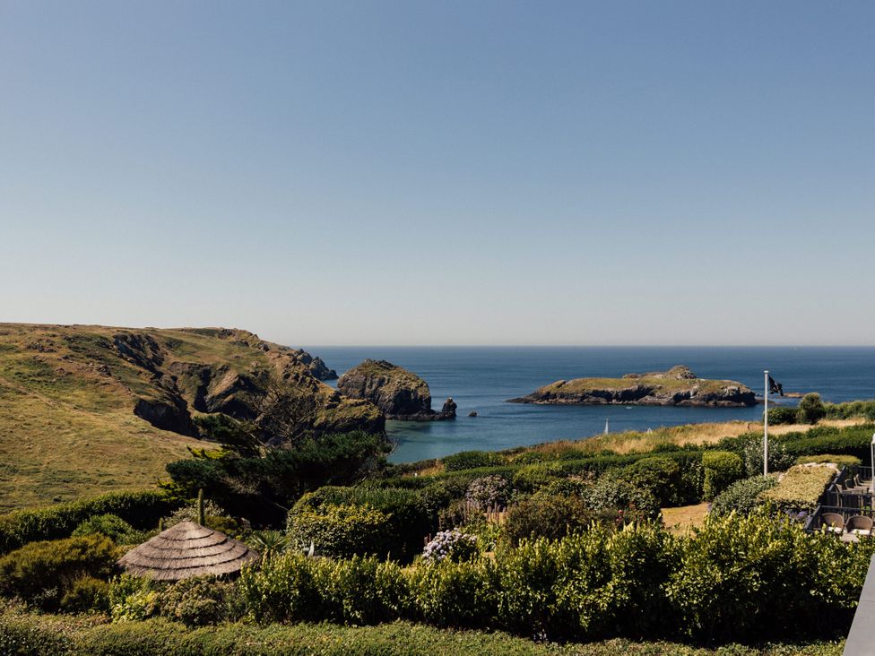 A coastal view with cliffs and islands at Trevean in Mullion