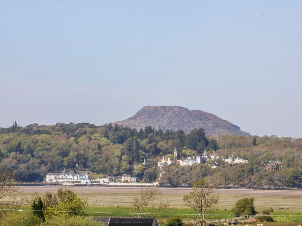 A mountain and town by the water at Tirionfa in Talsarnau