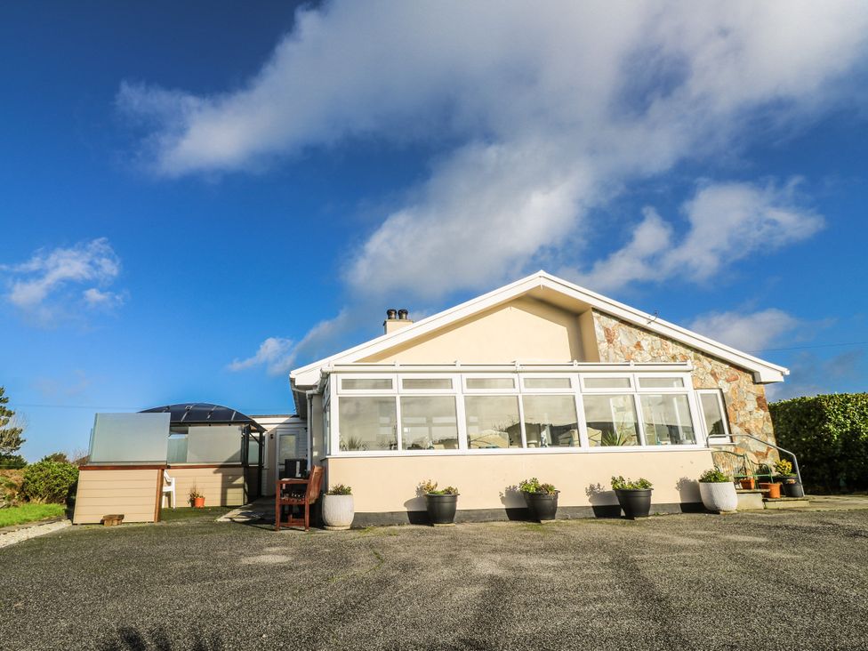 A house with windows and a stone wall at Tataramoa near Falmouth