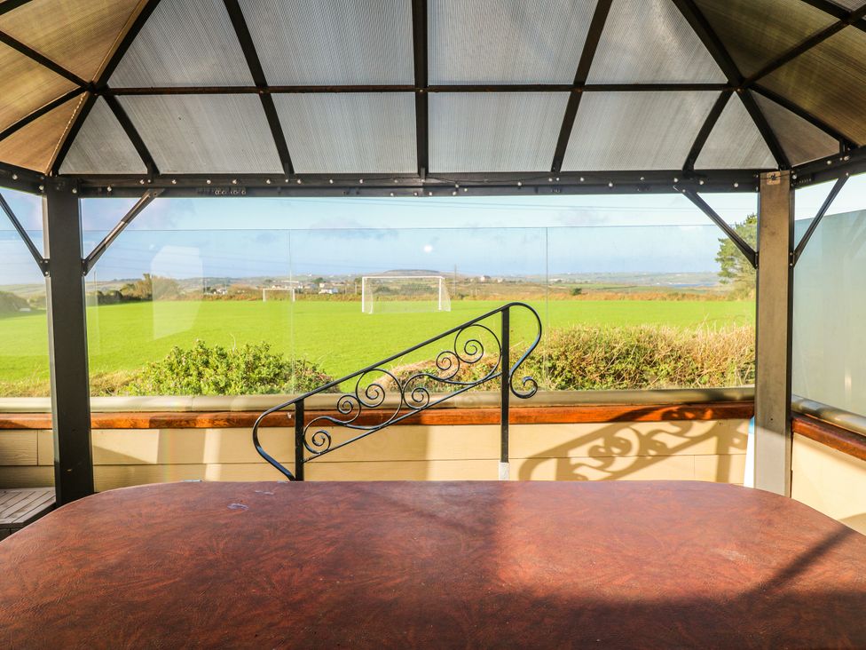 A gazebo with a view of grass and goal posts at Tataramoa near Falmouth