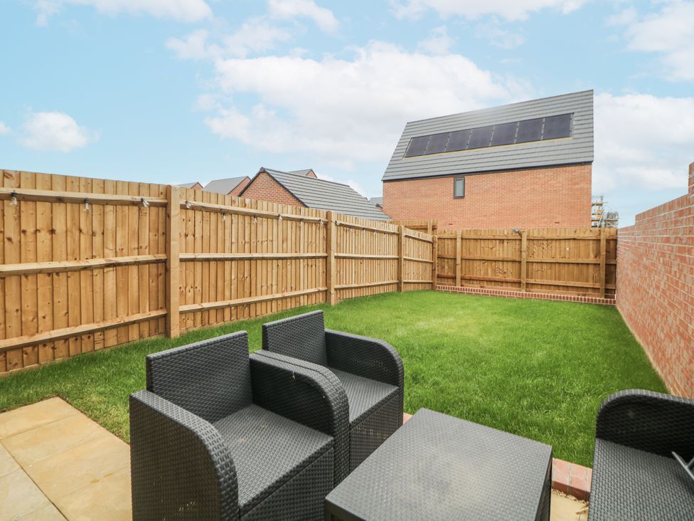 A garden with grass and outdoor furniture at Peak Avenue Retreat Wingerworth near Chesterfield