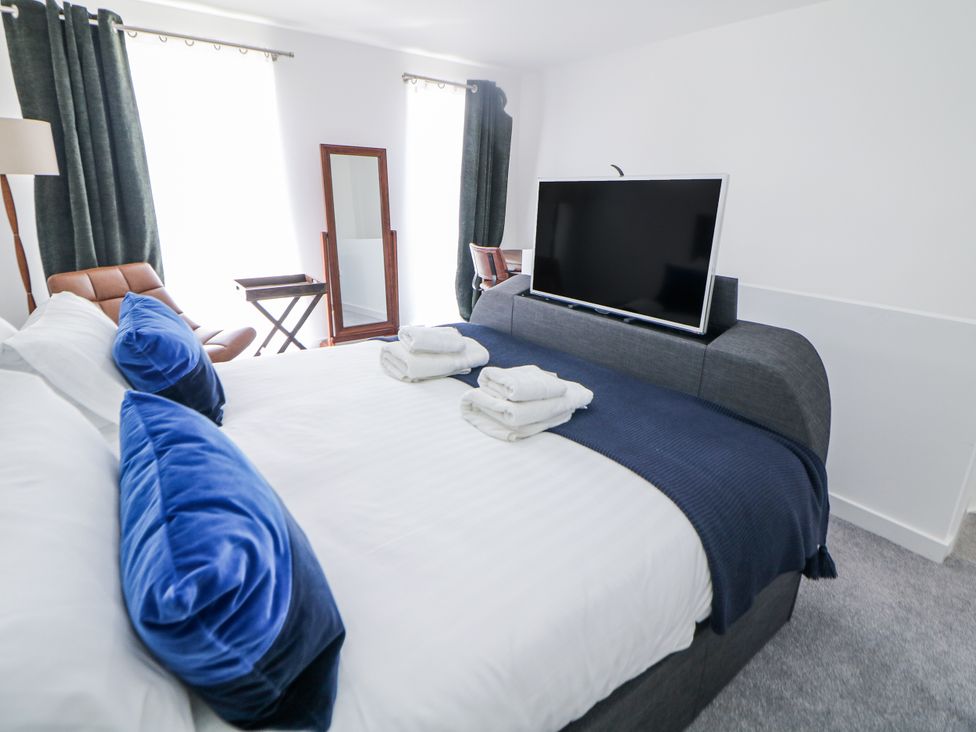 A bedroom with a bed and television at Peak Avenue Retreat in Wingerworth near Chesterfield