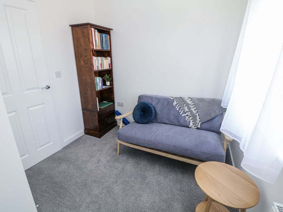 A home office with a sofa and bookshelf at Peak Avenue Retreat Wingerworth near Chesterfield