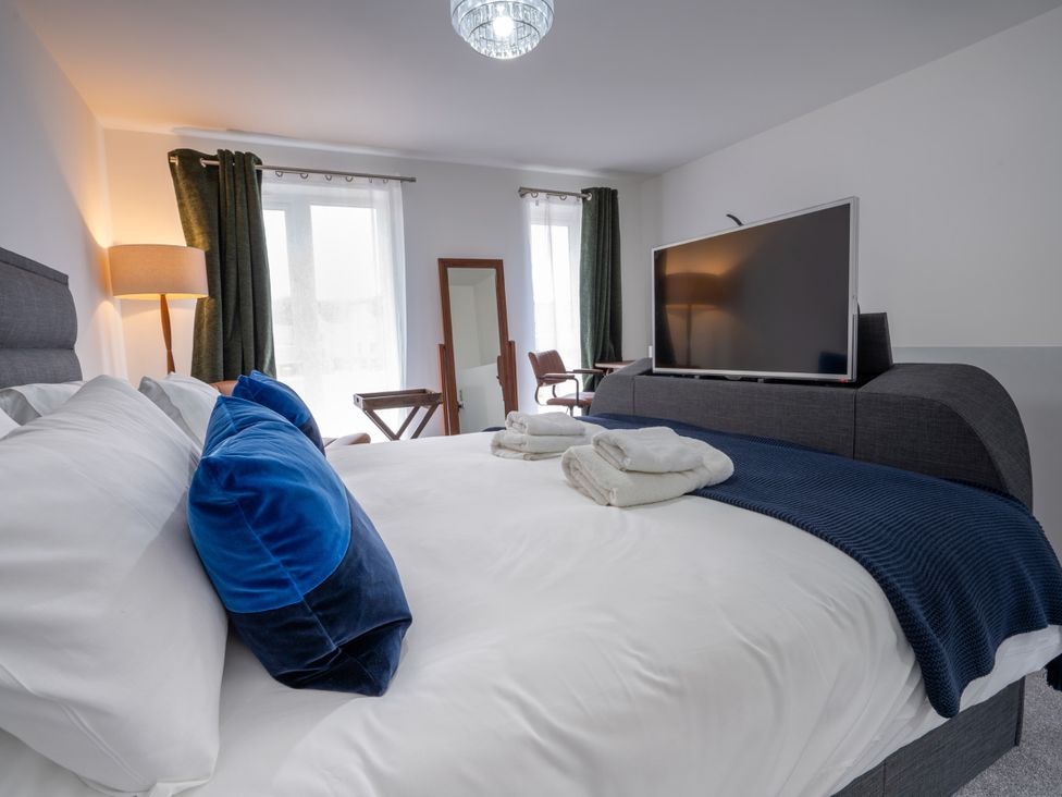 A bedroom with a bed and television at Peak Avenue Retreat in Wingerworth near Chesterfield