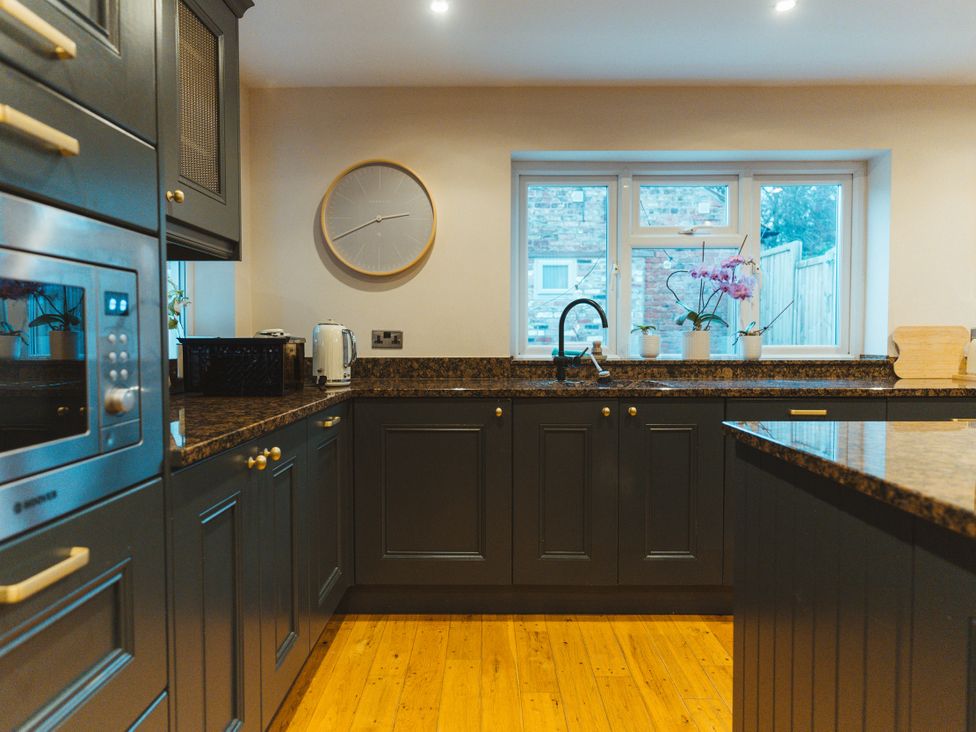 A kitchen with cabinets and countertop at Willow Garth Roecliffe near Boroughbridge