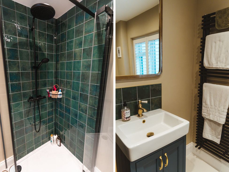 A bathroom with a shower and wash basin at Willow Garth Roecliffe near Boroughbridge