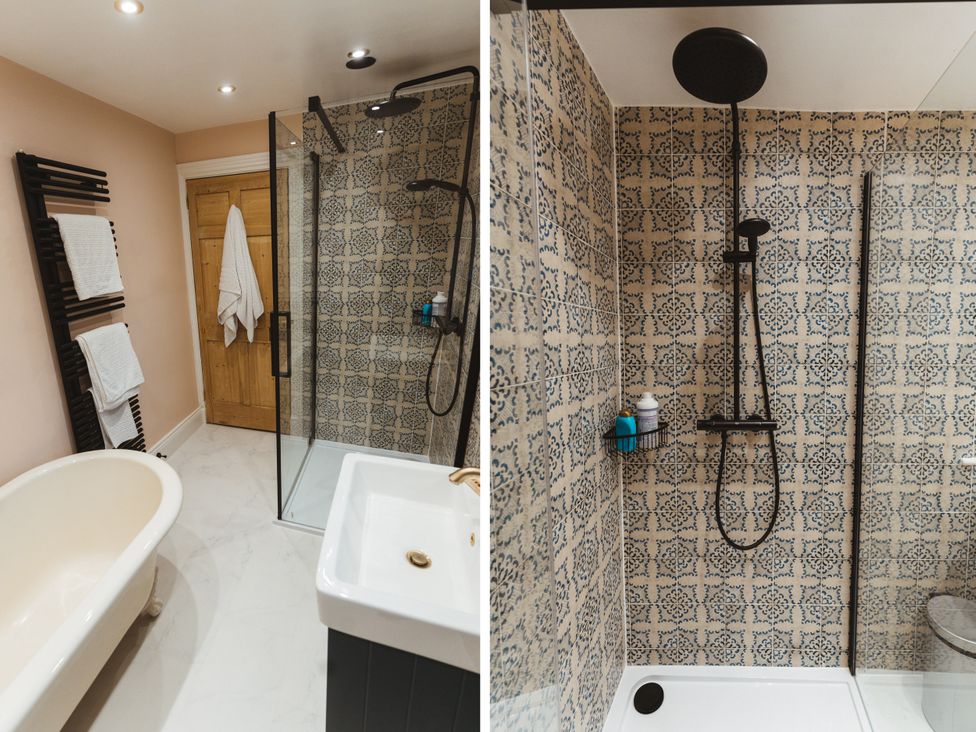 A bathroom with a bathtub and shower at Willow Garth Roecliffe near Boroughbridge