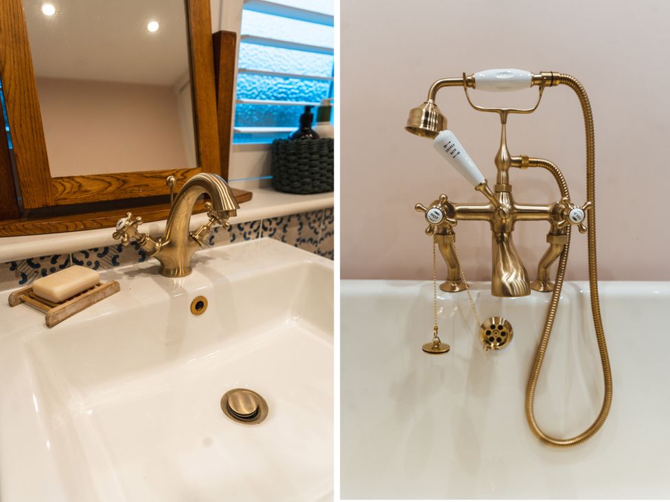 A sink and faucet with soap and a mirror alongside a bathtub faucet at Willow Garth Roecliffe near Boroughbridge