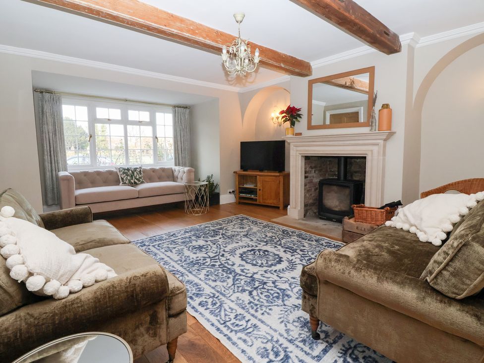 A living room with a sofa and television at Willow Garth in Roecliffe near Boroughbridge