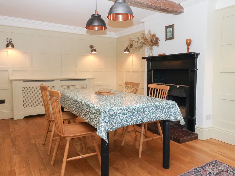 A dining room with a table and chairs at Willow Garth Roecliffe near Boroughbridge