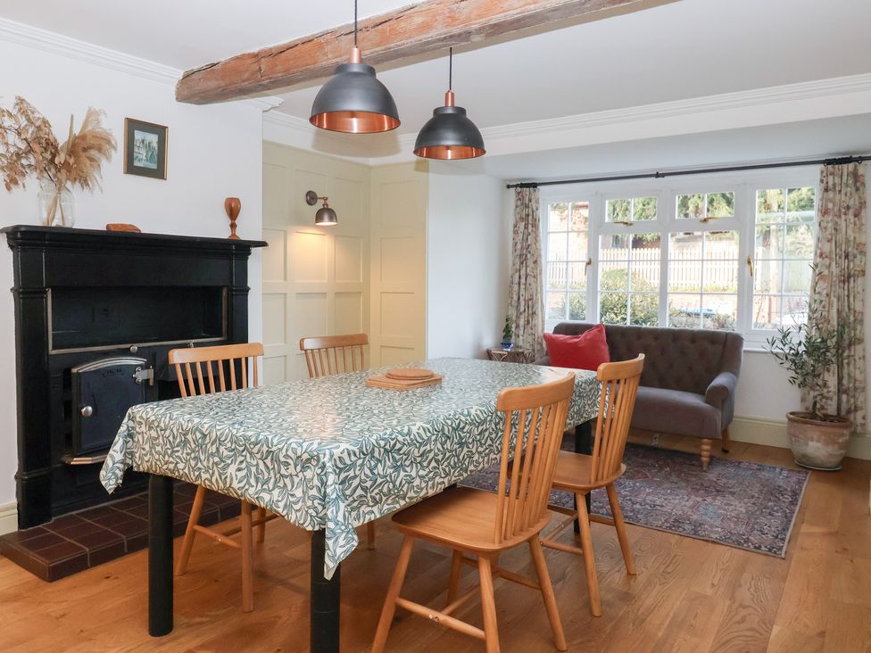 A dining room with a table and chairs at Willow Garth Roecliffe near Boroughbridge