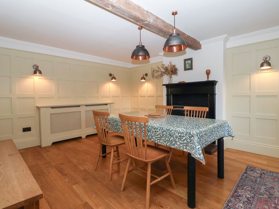 A dining room with a table and chairs at Willow Garth Roecliffe near Boroughbridge