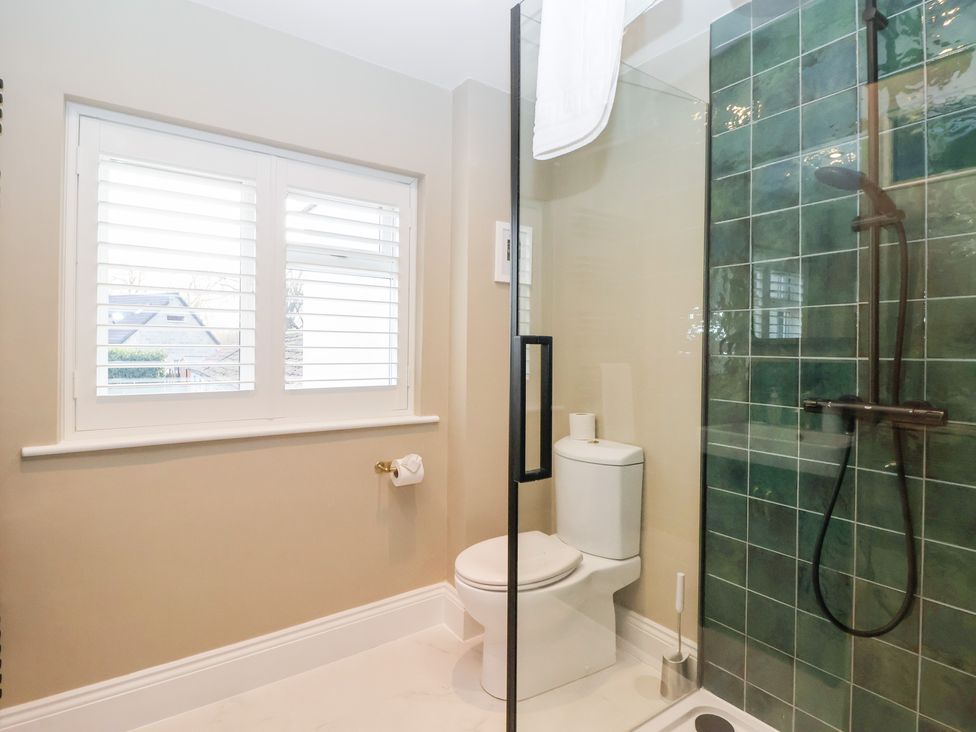 A bathroom with a shower and toilet at Willow Garth Roecliffe near Boroughbridge