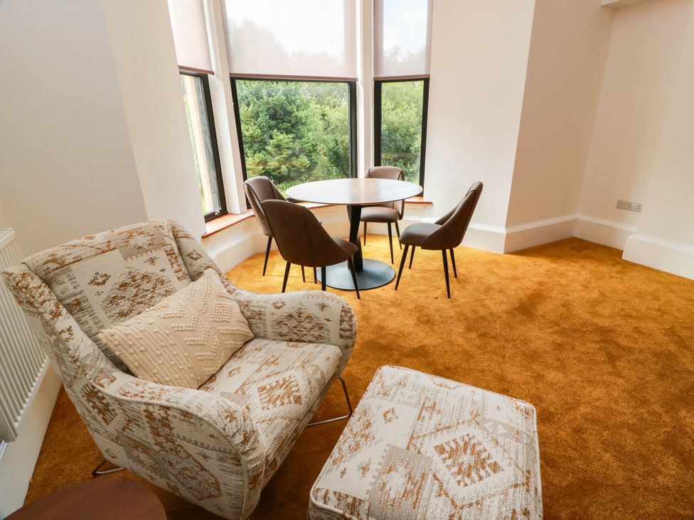 A dining room with chairs and a table at Winnocklands House