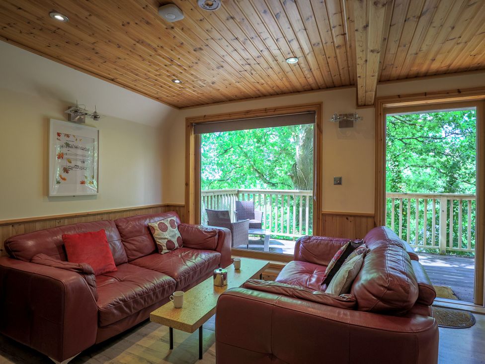 A living room with a sofa and coffee table at Lodge 68 - Fern Gully, Finlakes Holiday Park near Chudleigh