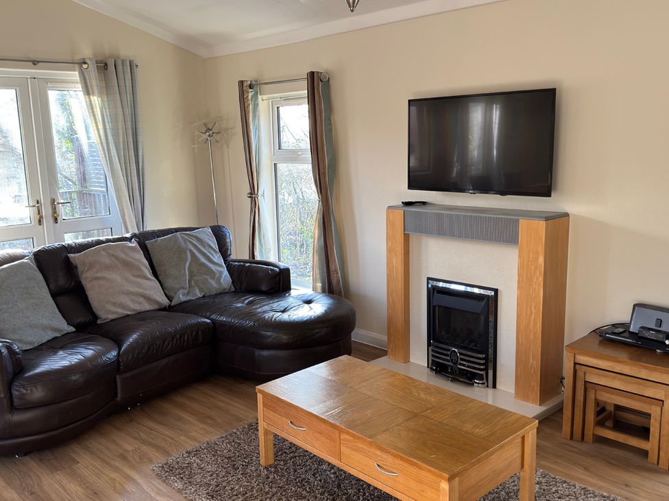 A living room with a sofa and coffee table at Woodland View 31 - The Hawthorns near Chudleigh
